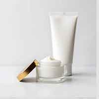 jar of cream and a tube of lotion
